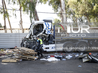 Medical and security teams respond to the scene where a truck crashed into a bus stop south of Tel Aviv, Israel, on October 27, 2024. The in...