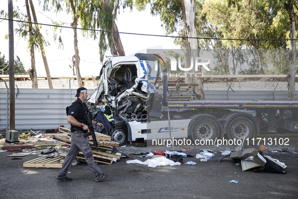 Medical and security teams respond to the scene where a truck crashed into a bus stop south of Tel Aviv, Israel, on October 27, 2024. The in...