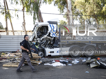 Medical and security teams respond to the scene where a truck crashed into a bus stop south of Tel Aviv, Israel, on October 27, 2024. The in...