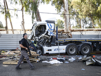 Medical and security teams respond to the scene where a truck crashed into a bus stop south of Tel Aviv, Israel, on October 27, 2024. The in...