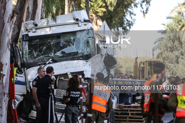 Medical and security teams respond to the scene where a truck crashed into a bus stop south of Tel Aviv, Israel, on October 27, 2024. The in...