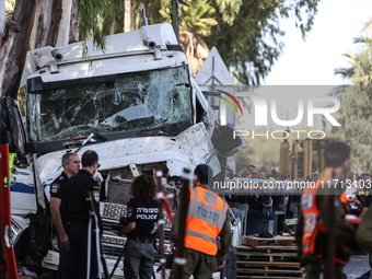 Medical and security teams respond to the scene where a truck crashed into a bus stop south of Tel Aviv, Israel, on October 27, 2024. The in...