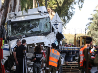 Medical and security teams respond to the scene where a truck crashed into a bus stop south of Tel Aviv, Israel, on October 27, 2024. The in...