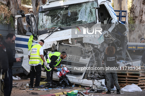 Medical and security teams respond to the scene where a truck crashed into a bus stop south of Tel Aviv, Israel, on October 27, 2024. The in...