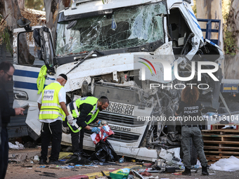 Medical and security teams respond to the scene where a truck crashed into a bus stop south of Tel Aviv, Israel, on October 27, 2024. The in...