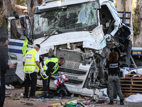 Medical and security teams respond to the scene where a truck crashed into a bus stop south of Tel Aviv, Israel, on October 27, 2024. The in...