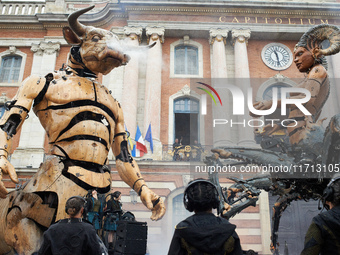 Asterion and Lilith stand face to face in front of the Capitole, the town hall of Toulouse. French street show creator Francois Delaroziere,...