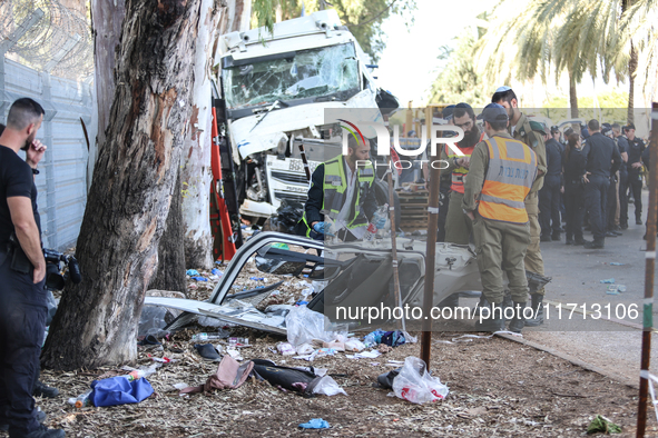 Medical and security teams respond to the scene where a truck crashed into a bus stop south of Tel Aviv, Israel, on October 27, 2024. The in...