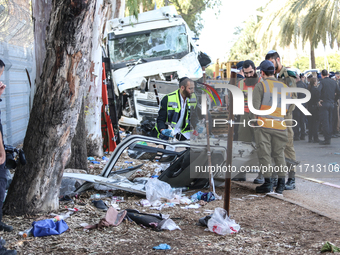 Medical and security teams respond to the scene where a truck crashed into a bus stop south of Tel Aviv, Israel, on October 27, 2024. The in...