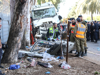 Medical and security teams respond to the scene where a truck crashed into a bus stop south of Tel Aviv, Israel, on October 27, 2024. The in...