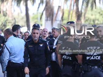 Medical and security teams respond to the scene where a truck crashed into a bus stop south of Tel Aviv, Israel, on October 27, 2024. The in...