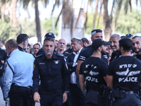 Medical and security teams respond to the scene where a truck crashed into a bus stop south of Tel Aviv, Israel, on October 27, 2024. The in...