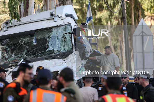 Medical and security teams respond to the scene where a truck crashed into a bus stop south of Tel Aviv, Israel, on October 27, 2024. The in...