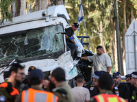 Medical and security teams respond to the scene where a truck crashed into a bus stop south of Tel Aviv, Israel, on October 27, 2024. The in...