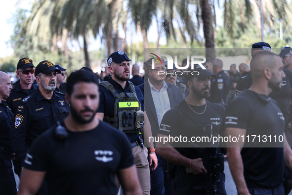 Medical and security teams respond to the scene where a truck crashed into a bus stop south of Tel Aviv, Israel, on October 27, 2024. The in...