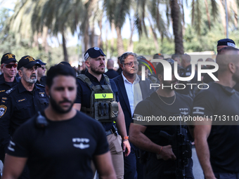 Medical and security teams respond to the scene where a truck crashed into a bus stop south of Tel Aviv, Israel, on October 27, 2024. The in...