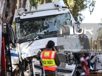 Medical and security teams respond to the scene where a truck crashed into a bus stop south of Tel Aviv, Israel, on October 27, 2024. The in...