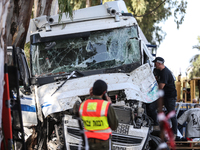 Medical and security teams respond to the scene where a truck crashed into a bus stop south of Tel Aviv, Israel, on October 27, 2024. The in...