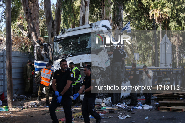 Medical and security teams respond to the scene where a truck crashed into a bus stop south of Tel Aviv, Israel, on October 27, 2024. The in...