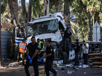 Medical and security teams respond to the scene where a truck crashed into a bus stop south of Tel Aviv, Israel, on October 27, 2024. The in...