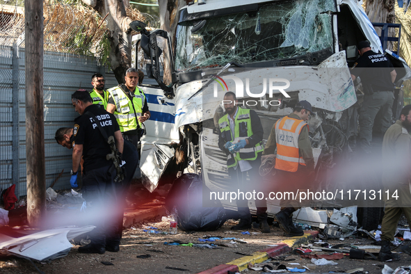 Medical and security teams respond to the scene where a truck crashed into a bus stop south of Tel Aviv, Israel, on October 27, 2024. The in...