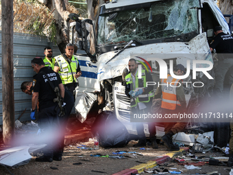 Medical and security teams respond to the scene where a truck crashed into a bus stop south of Tel Aviv, Israel, on October 27, 2024. The in...