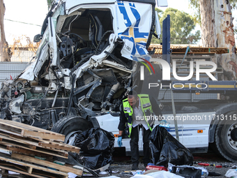 Medical and security teams respond to the scene where a truck crashed into a bus stop south of Tel Aviv, Israel, on October 27, 2024. The in...