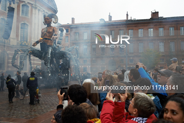 People take films and pictures of the arrival of Lilith in the main square of Toulouse, the Capitole. French street show creator Francois De...