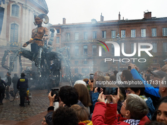 People take films and pictures of the arrival of Lilith in the main square of Toulouse, the Capitole. French street show creator Francois De...