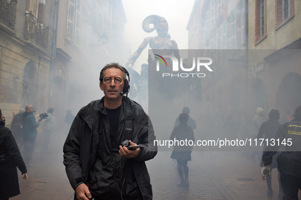 Francois Delaroziere, head of the art company 'La Machine,' guides Lilith in one of the tiniest streets of Toulouse. French street show crea...