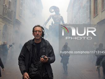 Francois Delaroziere, head of the art company 'La Machine,' guides Lilith in one of the tiniest streets of Toulouse. French street show crea...