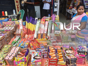 A woman sells firecrackers ahead of the Diwali festival in Kolkata, India, on October 27, 2024. (