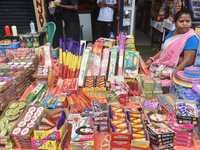 A woman sells firecrackers ahead of the Diwali festival in Kolkata, India, on October 27, 2024. (