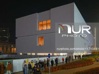 People wait in line outside the new Museum of Modern Art (Muzeum Sztuki Nowoczesnej) in Warsaw, Poland on 25 October, 2024. (