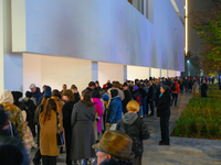 People wait in line outside the new Museum of Modern Art (Muzeum Sztuki Nowoczesnej) in Warsaw, Poland on 25 October, 2024. (