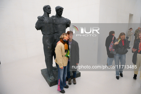 Visitors are seen on the evening of the opening of the new Museum of Modern Art (Muzeum Sztuki Nowoczesnej) in Warsaw, Poland on 25 October,...