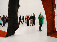 Visitors observe a sculpture by Magdalena Abakanowicz at the new Museum of Modern Art (Muzeum Sztuki Nowoczesnej) in Warsaw, Poland on 25 Oc...