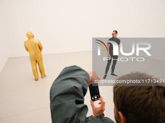 Visitors are seen on the evening of the opening of the new Museum of Modern Art (Muzeum Sztuki Nowoczesnej) in Warsaw, Poland on 25 October,...