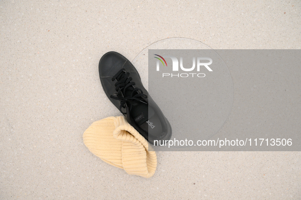 A hat and a shoe are seen on the floor of the new Museum of Modern Art (Muzeum Sztuki Nowoczesnej) in Warsaw, Poland on 25 October, 2024. 