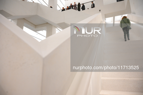 Visitors are seen on the evening of the opening of the new Museum of Modern Art (Muzeum Sztuki Nowoczesnej) in Warsaw, Poland on 25 October,...