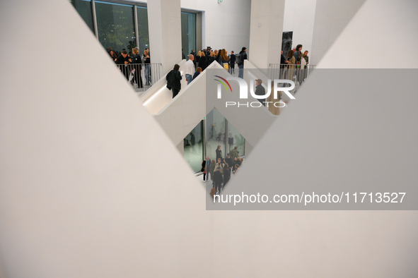 Visitors are seen on the evening of the opening of the new Museum of Modern Art (Muzeum Sztuki Nowoczesnej) in Warsaw, Poland on 25 October,...