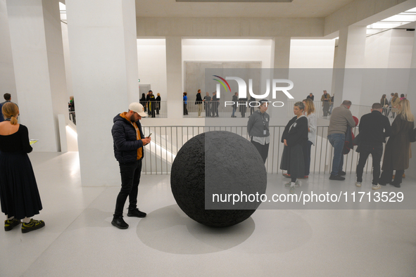 Visitors are seen on the evening of the opening of the new Museum of Modern Art (Muzeum Sztuki Nowoczesnej) in Warsaw, Poland on 25 October,...