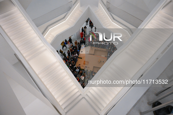 Visitors are seen on the evening of the opening of the new Museum of Modern Art (Muzeum Sztuki Nowoczesnej) in Warsaw, Poland on 25 October,...