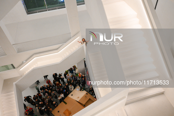 Visitors are seen on the evening of the opening of the new Museum of Modern Art (Muzeum Sztuki Nowoczesnej) in Warsaw, Poland on 25 October,...