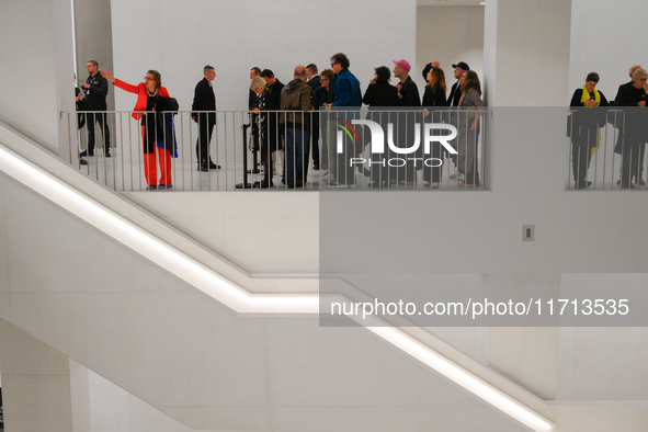 Visitors await a performance at the opening of the new Museum of Modern Art (Muzeum Sztuki Nowoczesnej) in Warsaw, Poland on 25 October, 202...