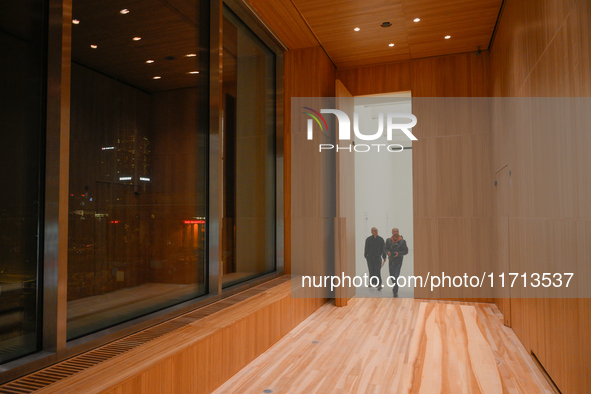 Visitors are seen on the evening of the opening of the new Museum of Modern Art (Muzeum Sztuki Nowoczesnej) in Warsaw, Poland on 25 October,...