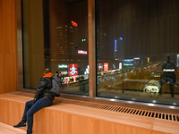 A man looks out a window of the new Museum of Modern Art (Muzeum Sztuki Nowoczesnej) in Warsaw, Poland on 25 October, 2024. (