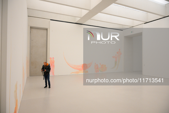 A photographer is seen at the opening of the new Museum of Modern Art (Muzeum Sztuki Nowoczesnej) in Warsaw, Poland on 25 October, 2024. 