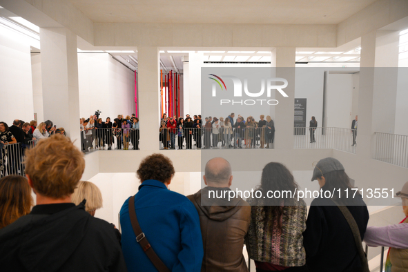 Visitors are seen on the evening of the opening of the new Museum of Modern Art (Muzeum Sztuki Nowoczesnej) in Warsaw, Poland on 25 October,...