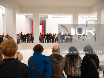 Visitors are seen on the evening of the opening of the new Museum of Modern Art (Muzeum Sztuki Nowoczesnej) in Warsaw, Poland on 25 October,...